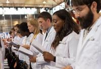Medical students recite the Hippocratic Oath during the White Coat Ceremony at Columbia University Vagelos College of Physicians and Surgeons